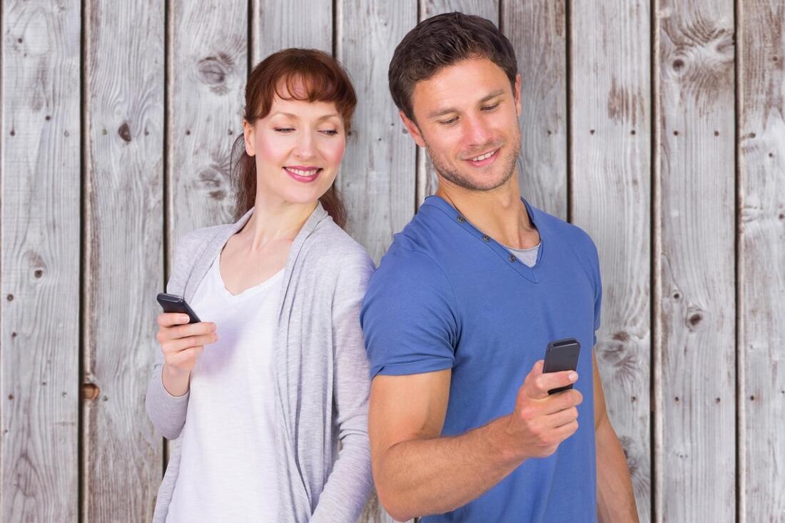 couple holding their phone
