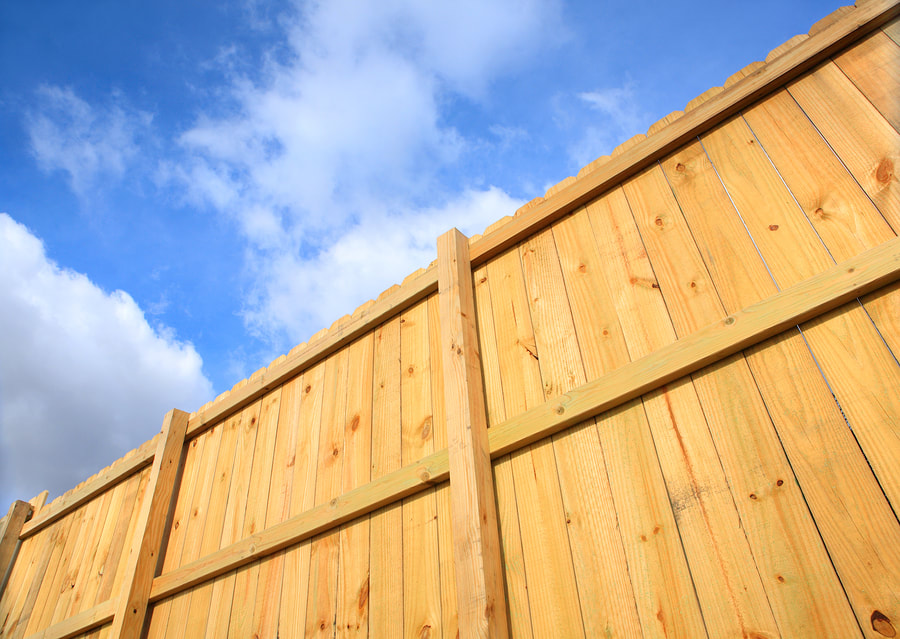 a wood residential fence